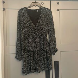 Black long-sleeve mini dress. Lined. Sheer sleeves